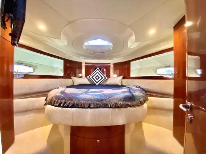Mahalo Yacht Photos Pics Luxurious cabin interior of 2007 Fairline Targa 52 yacht with elegant bedding.