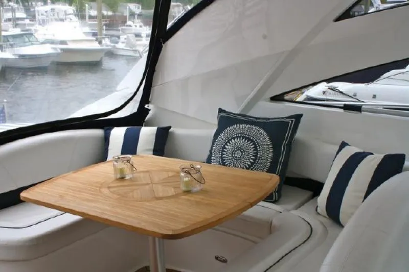 Mahalo Yacht Photos Pics Luxurious 2007 Fairline Targa 52 yacht interior with elegant seating and wooden table.