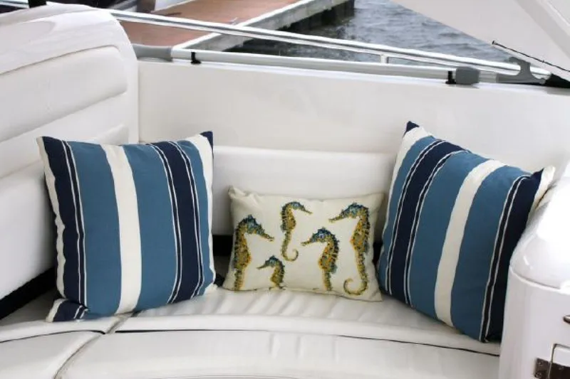 Mahalo Yacht Photos Pics Luxurious seating with striped and seahorse pillows on a 2007 Fairline Targa 52 yacht.