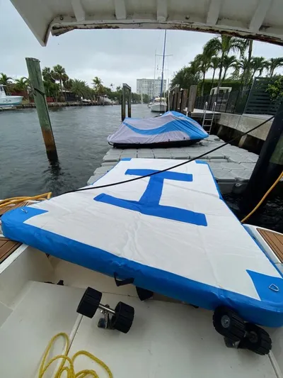 Mahalo Yacht Photos Pics 2007 Fairline Targa 52 yacht docked with covered equipment on deck.
