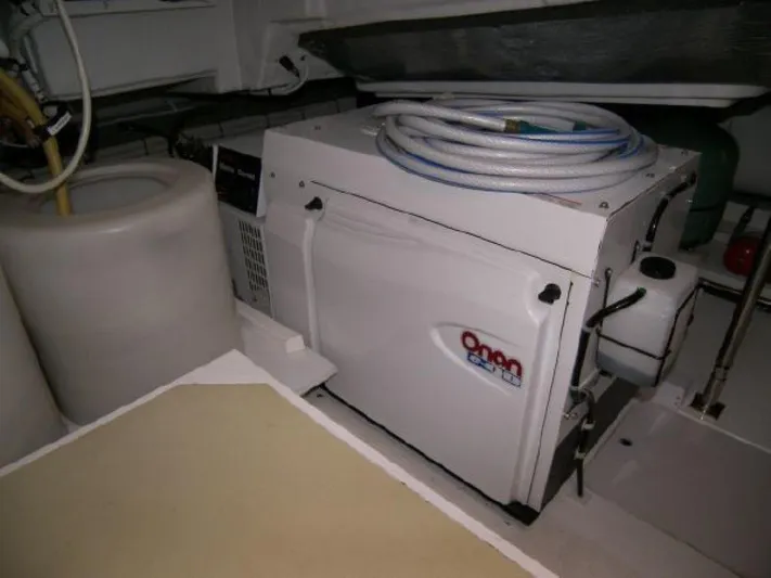 Mahalo Yacht Photos Pics Engine room of 2007 Fairline Targa 52 yacht with Onan generator and equipment.