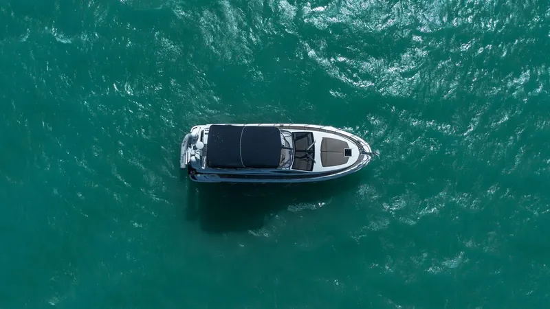 Seanner Yacht Photos Pics Aerial view of 2014 Azimut 45 Flybridge yacht on turquoise water.