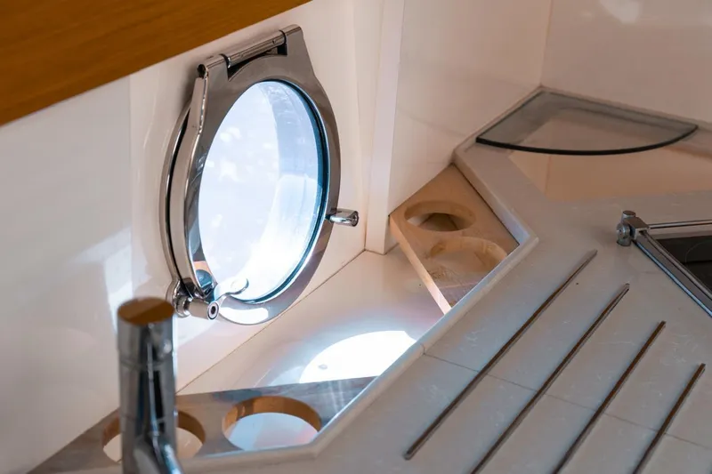 Seanner Yacht Photos Pics Porthole window and countertop on 2014 Azimut 45 Flybridge yacht interior.