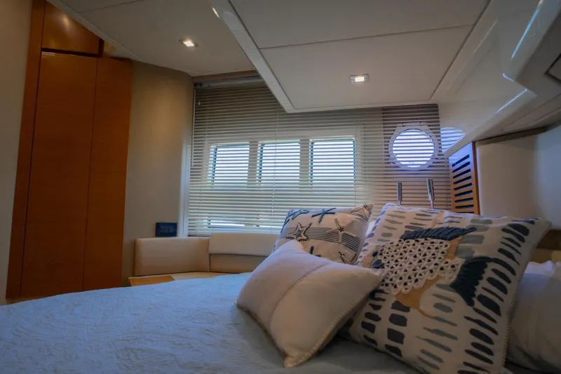 Seanner Yacht Photos Pics Luxurious bedroom interior of 2014 Azimut 45 Flybridge yacht with nautical-themed decor.