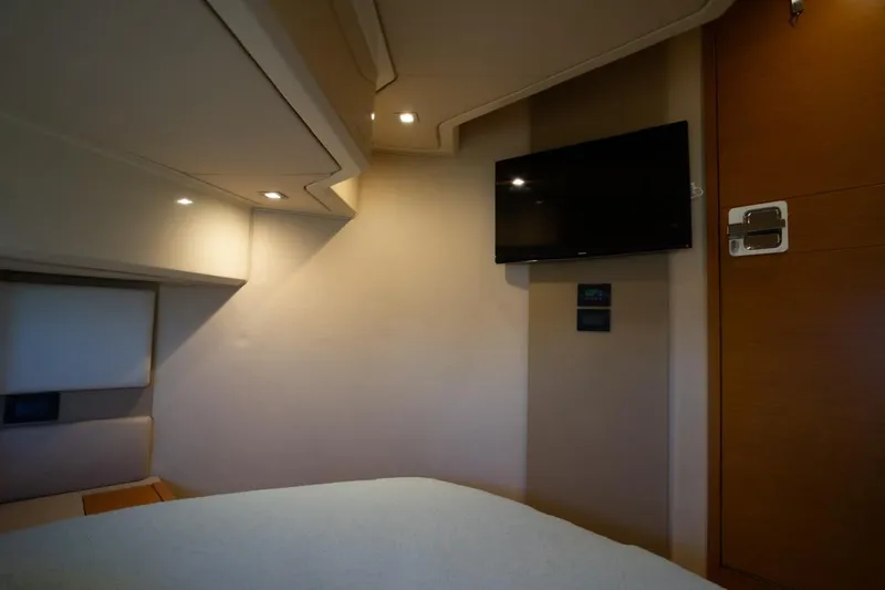 Seanner Yacht Photos Pics Luxurious interior of 2014 Azimut 45 Flybridge yacht with TV and modern lighting.