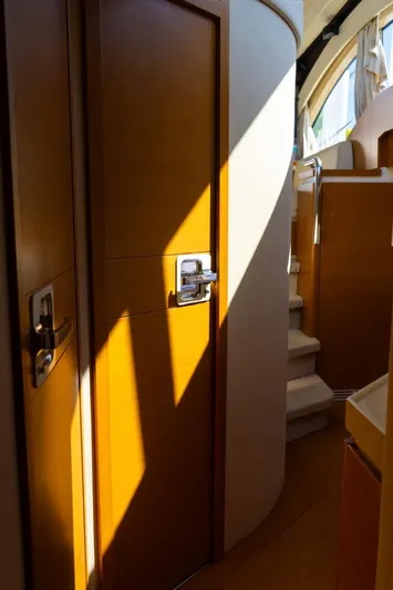 Seanner Yacht Photos Pics Interior of 2014 Azimut 45 Flybridge yacht with wooden doors and staircase.