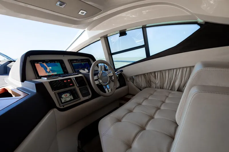 Seanner Yacht Photos Pics Luxurious interior of 2014 Azimut 45 Flybridge yacht with modern navigation system and plush seating.