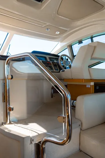 Seanner Yacht Photos Pics Interior view of 2014 Azimut 45 Flybridge yacht, featuring helm and seating area.