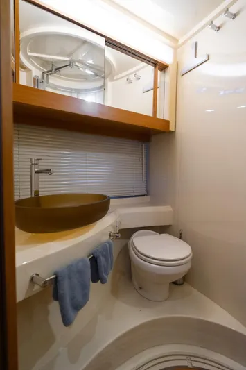 Seanner Yacht Photos Pics Luxurious bathroom in 2014 Azimut 45 Flybridge yacht with modern fixtures and elegant design.