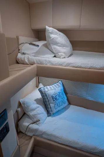 Seanner Yacht Photos Pics Bunk beds in 2014 Azimut 45 Flybridge yacht cabin with cozy pillows and reading lights.