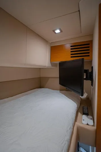 Seanner Yacht Photos Pics 2014 Azimut 45 Flybridge cabin with bed, wall-mounted TV, and modern interior design.