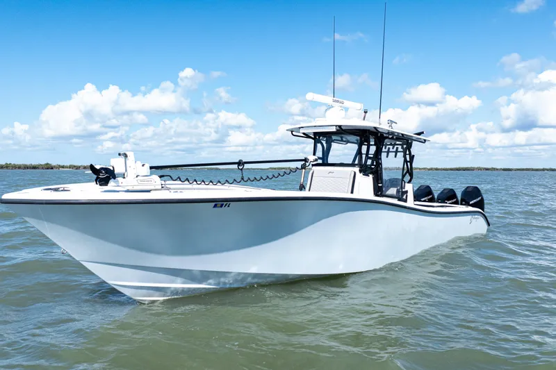  Yacht Photos Pics 2019 Yellowfin 36 Offshore boat on open water under blue sky.