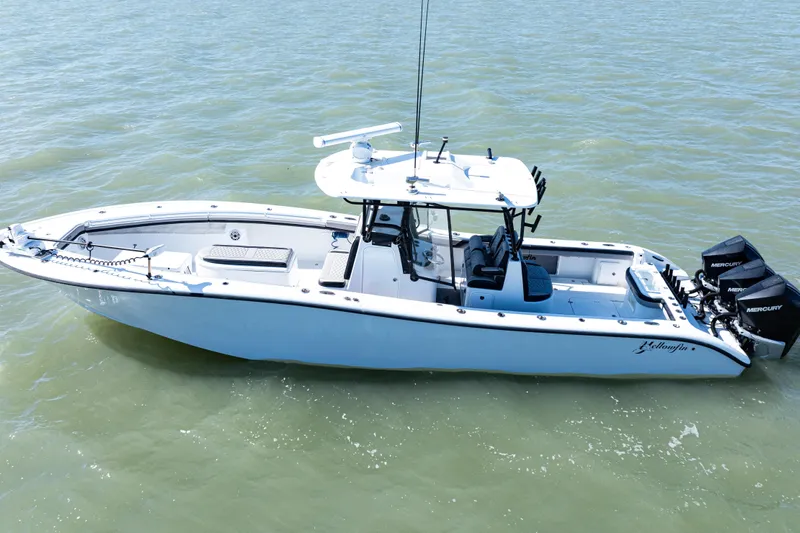  Yacht Photos Pics 2019 Yellowfin 36 Offshore boat on water, featuring triple Mercury engines.