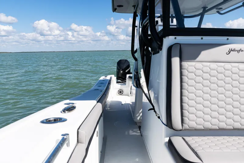  Yacht Photos Pics 2019 Yellowfin 36 Offshore boat on open water, featuring sleek seating and modern design.