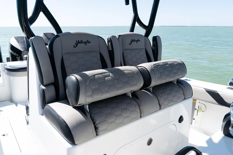  Yacht Photos Pics 2019 Yellowfin 36 Offshore boat seats with hexagonal pattern, on calm ocean water.
