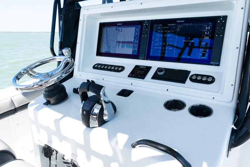  Yacht Photos Pics 2019 Yellowfin 36 Offshore boat dashboard with dual Simrad displays and controls.