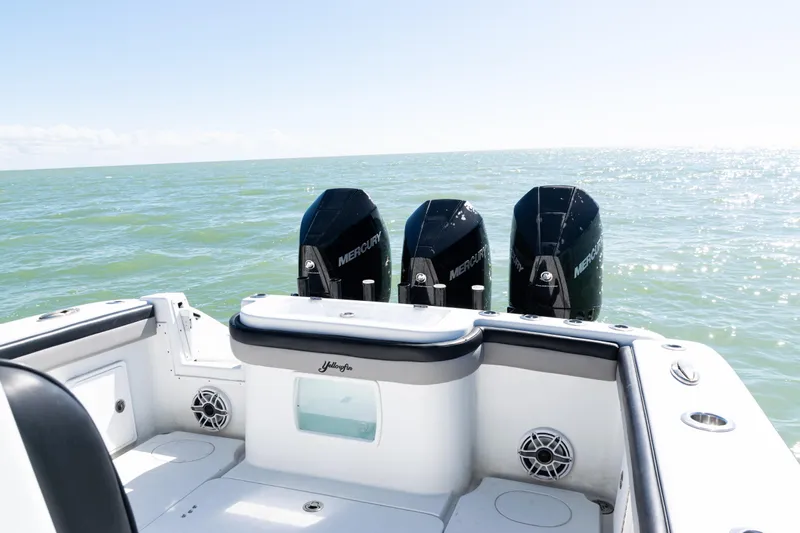  Yacht Photos Pics 2019 Yellowfin 36 Offshore boat with triple Mercury engines on open sea.