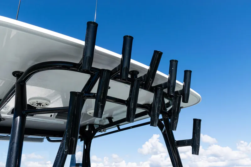  Yacht Photos Pics 2019 Yellowfin 36 Offshore boat with rod holders against blue sky.