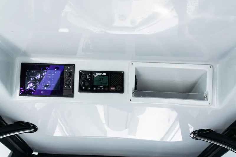  Yacht Photos Pics 2019 Yellowfin 36 Offshore dashboard with Simrad electronics and storage compartment.