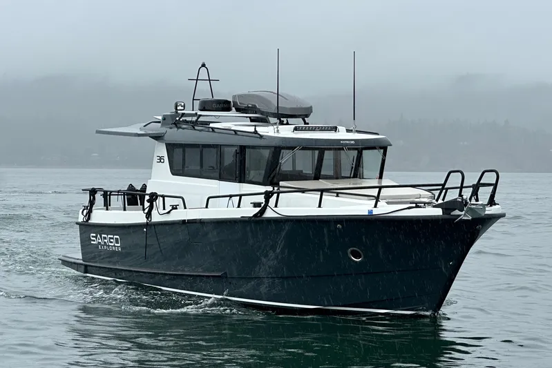  Yacht Photos Pics 2024 Sargo 36 Explorer boat cruising on a misty waterway.