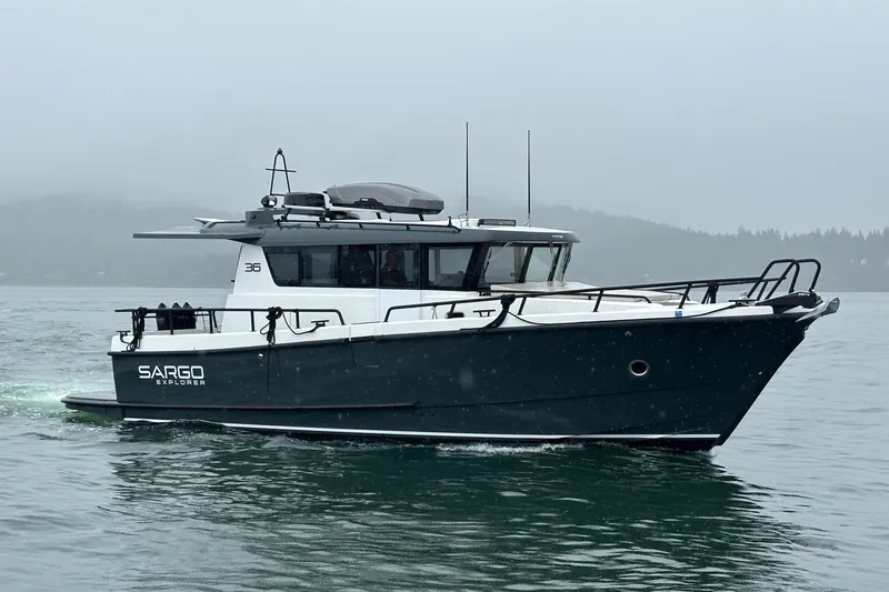  Yacht Photos Pics 2024 Sargo 36 Explorer boat cruising on a misty lake.