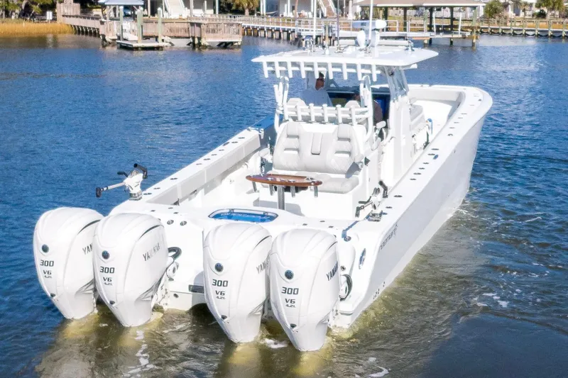  Yacht Photos Pics 2024 Freeman 38 boat with four Yamaha 300 V6 engines on a calm waterway.