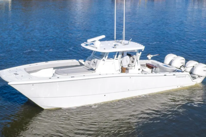  Yacht Photos Pics 2024 Freeman 38 boat on water, featuring sleek design and powerful engines.