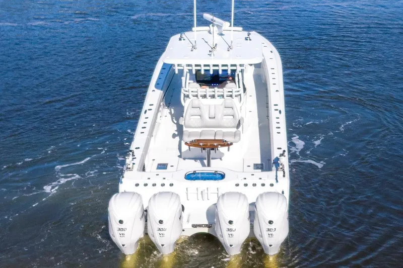  Yacht Photos Pics 2024 Freeman 38 boat with four powerful outboard engines on open water.