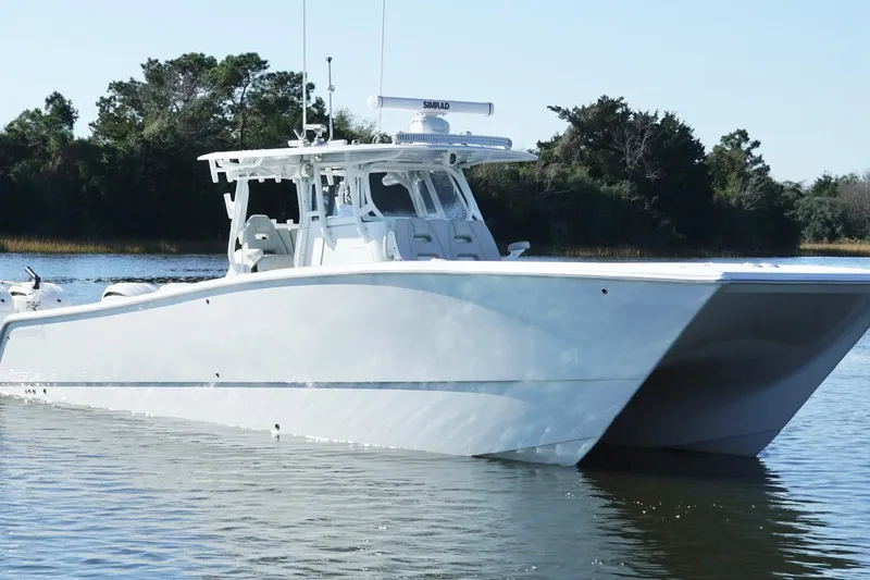  Yacht Photos Pics 2024 Freeman 38 boat on calm water, showcasing sleek design and modern features.
