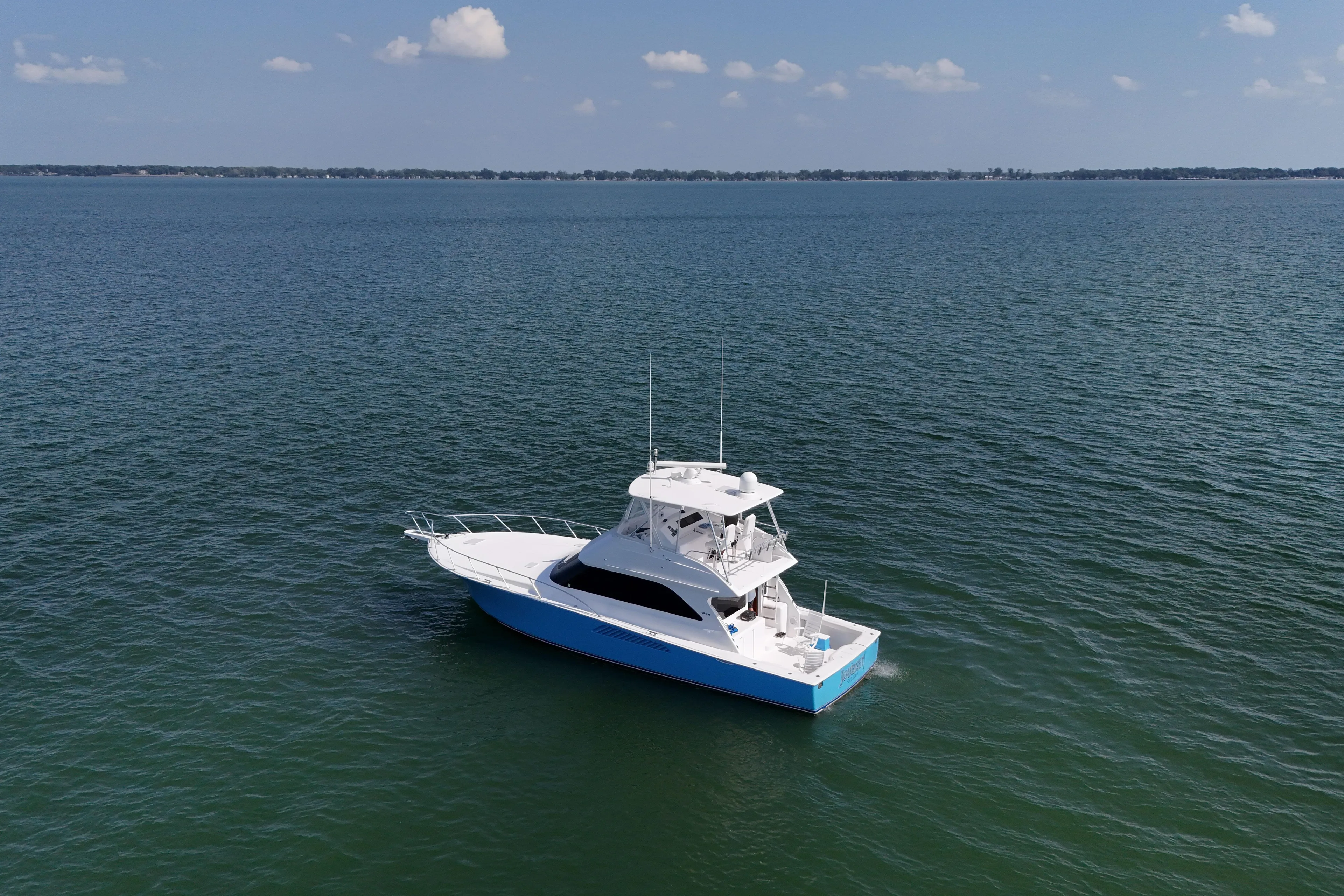 Journey Yacht Photos Pics 2003 Viking 48 Convertible yacht on open water under clear sky.