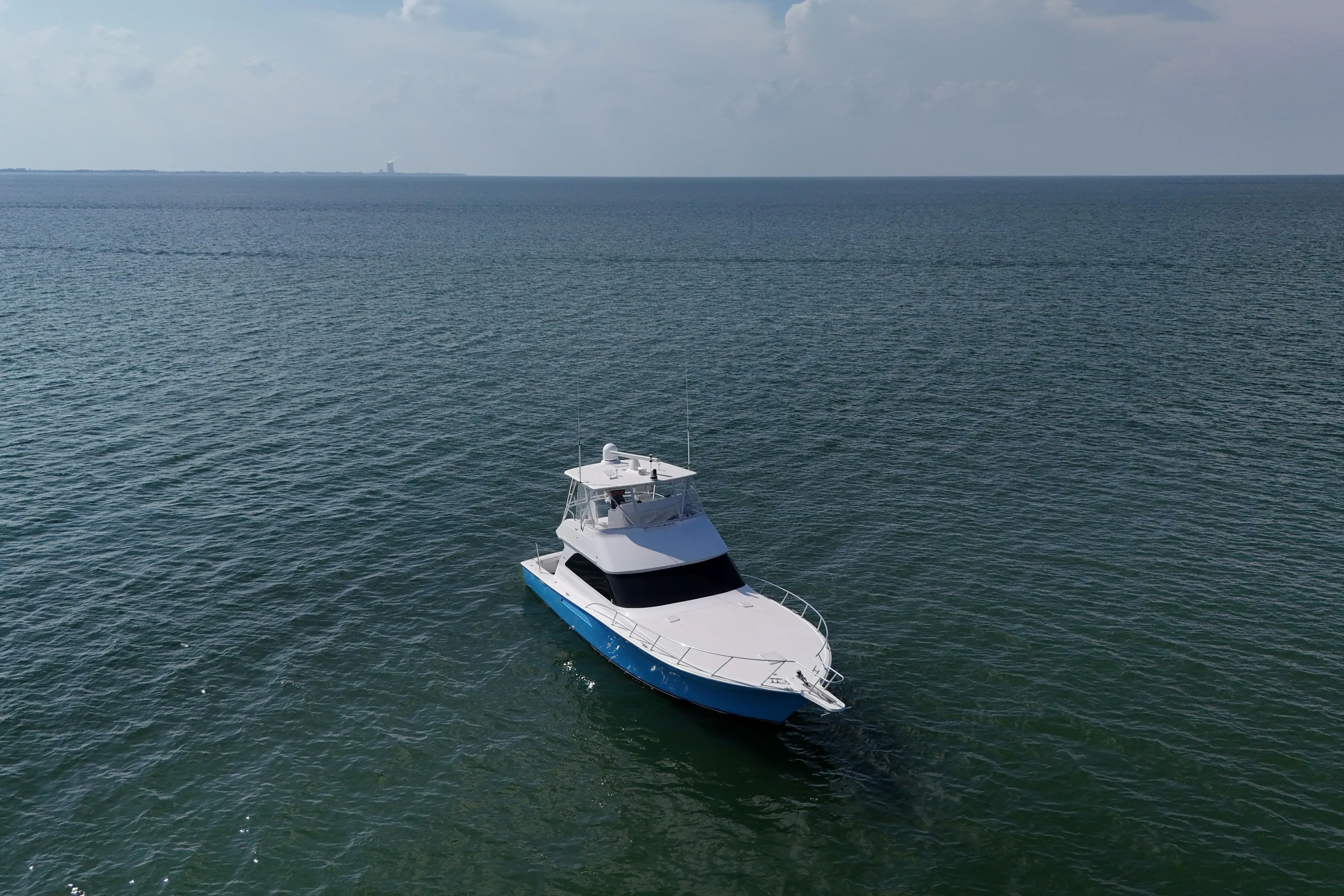 Journey Yacht Photos Pics 2003 Viking 48 Convertible yacht cruising on open sea under clear sky.