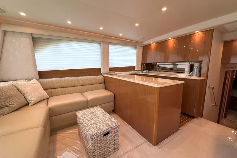 Journey Yacht Photos Pics Luxurious interior of 2003 Viking 48 Convertible yacht with modern kitchen and cozy seating area.