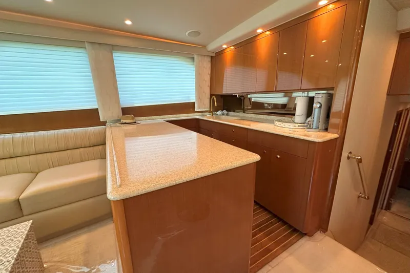 Journey Yacht Photos Pics Luxurious interior of 2003 Viking 48 Convertible yacht with modern kitchen and seating area.
