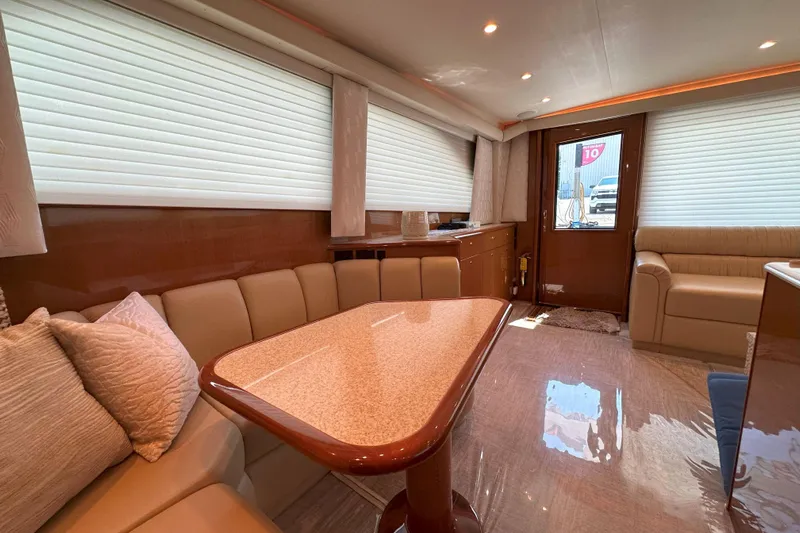 Journey Yacht Photos Pics Luxurious interior of 2003 Viking 48 Convertible yacht with elegant seating and dining area.