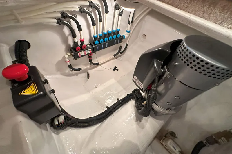 Journey Yacht Photos Pics Engine compartment of a 2003 Viking 48 Convertible boat, showcasing wiring and components.