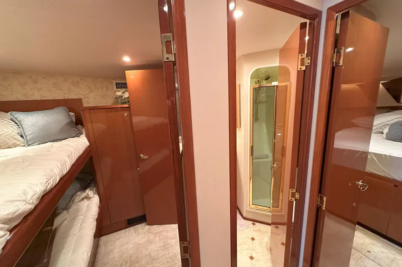 Journey Yacht Photos Pics Interior of 2003 Viking 48 Convertible yacht with bunk beds and bathroom.