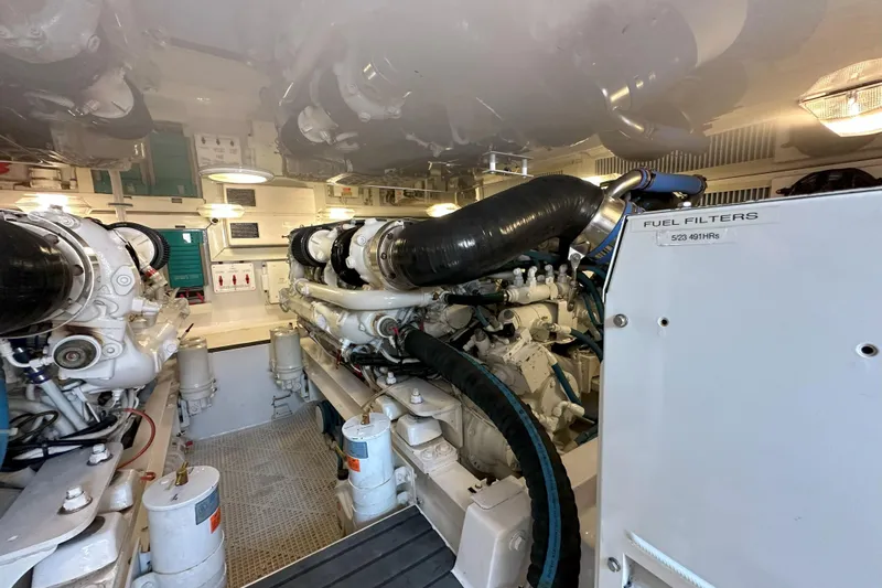 Journey Yacht Photos Pics Engine room of 2003 Viking 48 Convertible yacht, showcasing machinery and fuel filters.