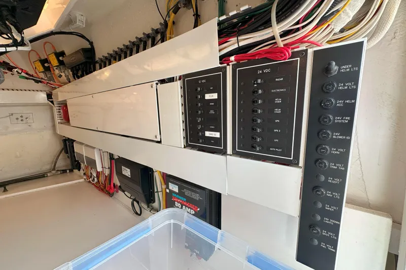 Journey Yacht Photos Pics Electrical panel of a 2003 Viking 48 Convertible yacht, showcasing wiring and circuit breakers.