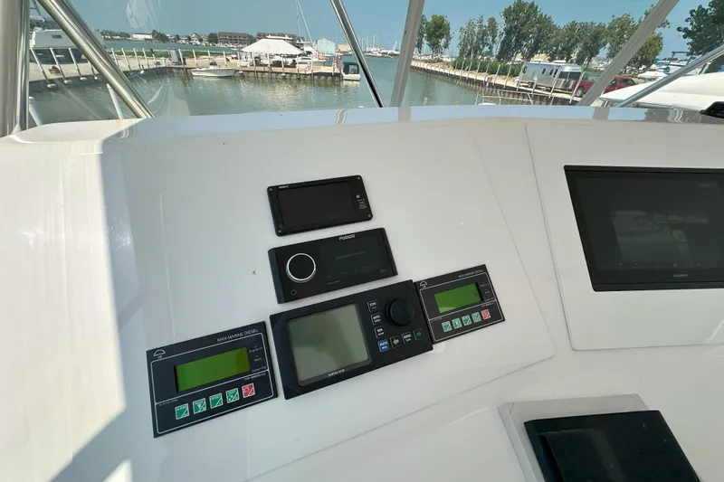 Journey Yacht Photos Pics Control panel of 2003 Viking 48 Convertible yacht with navigation and communication systems.