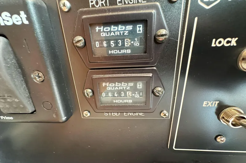 Journey Yacht Photos Pics Hobbs hour meters on 2003 Viking 48 Convertible boat dashboard.