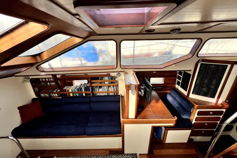  Yacht Photos Pics Luxurious interior of 2014 Custom Aluminum Expedition yacht with blue seating and wooden accents.