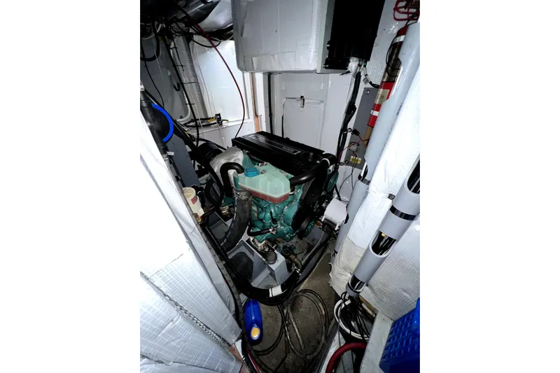  Yacht Photos Pics Engine room of a 2014 Custom Aluminum Expedition boat, featuring complex wiring and components.