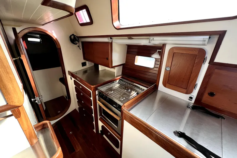  Yacht Photos Pics 2014 Custom Aluminum Expedition yacht interior with wood cabinetry and stainless steel kitchen.