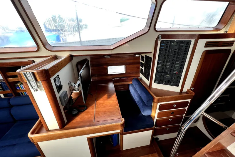  Yacht Photos Pics Interior of 2014 Custom Aluminum Expedition yacht with wood paneling and navigation equipment.