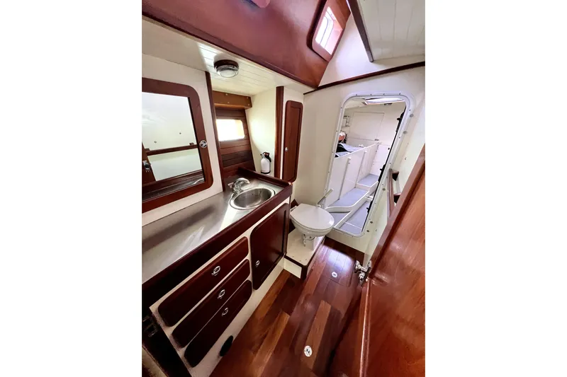  Yacht Photos Pics Luxurious 2014 Custom Aluminum Expedition yacht bathroom with wood accents and modern fixtures.