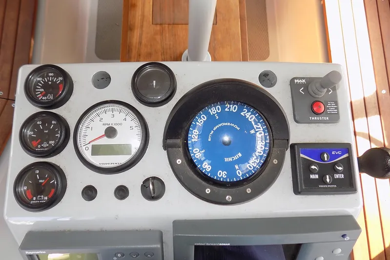  Yacht Photos Pics Control panel of a 2014 Custom Aluminum Expedition boat with gauges and compass.