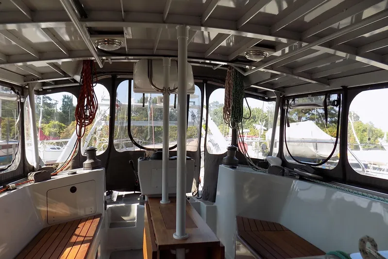  Yacht Photos Pics Interior of 2014 Custom Aluminum Expedition boat with wooden benches and nautical equipment.