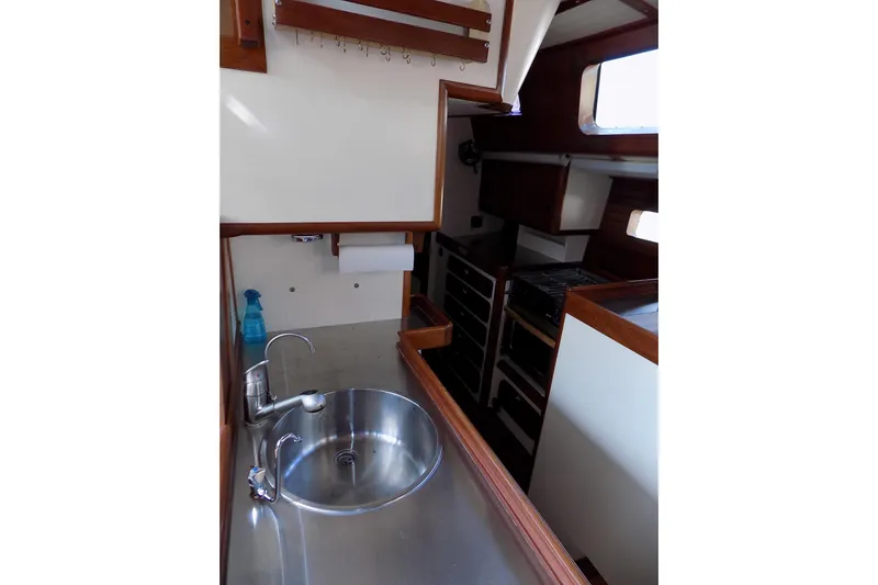  Yacht Photos Pics Interior of 2014 Custom Aluminum Expedition boat with stainless steel sink and wooden accents.