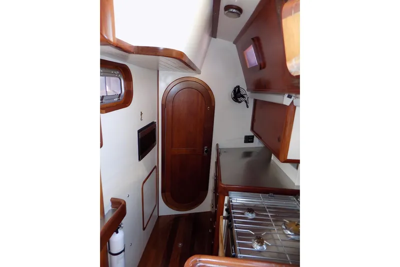  Yacht Photos Pics Interior of 2014 Custom Aluminum Expedition yacht with wood accents and compact kitchen area.