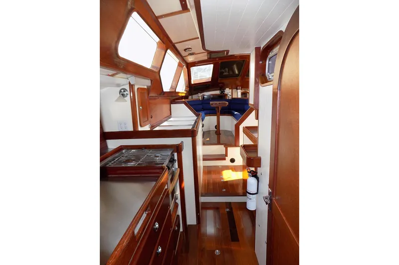  Yacht Photos Pics Interior of 2014 Custom Aluminum Expedition yacht with wood finishes and compact kitchen.